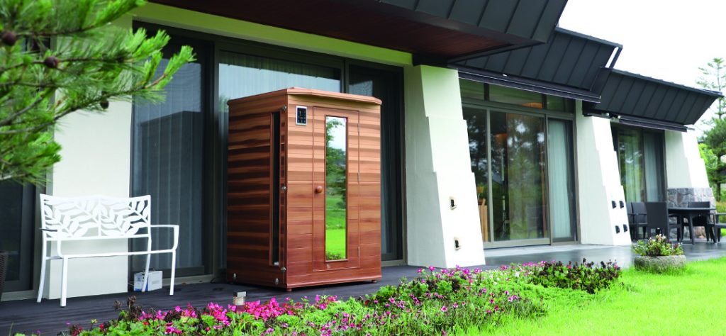 Infrared sauna placed on back patio with protective overhang
